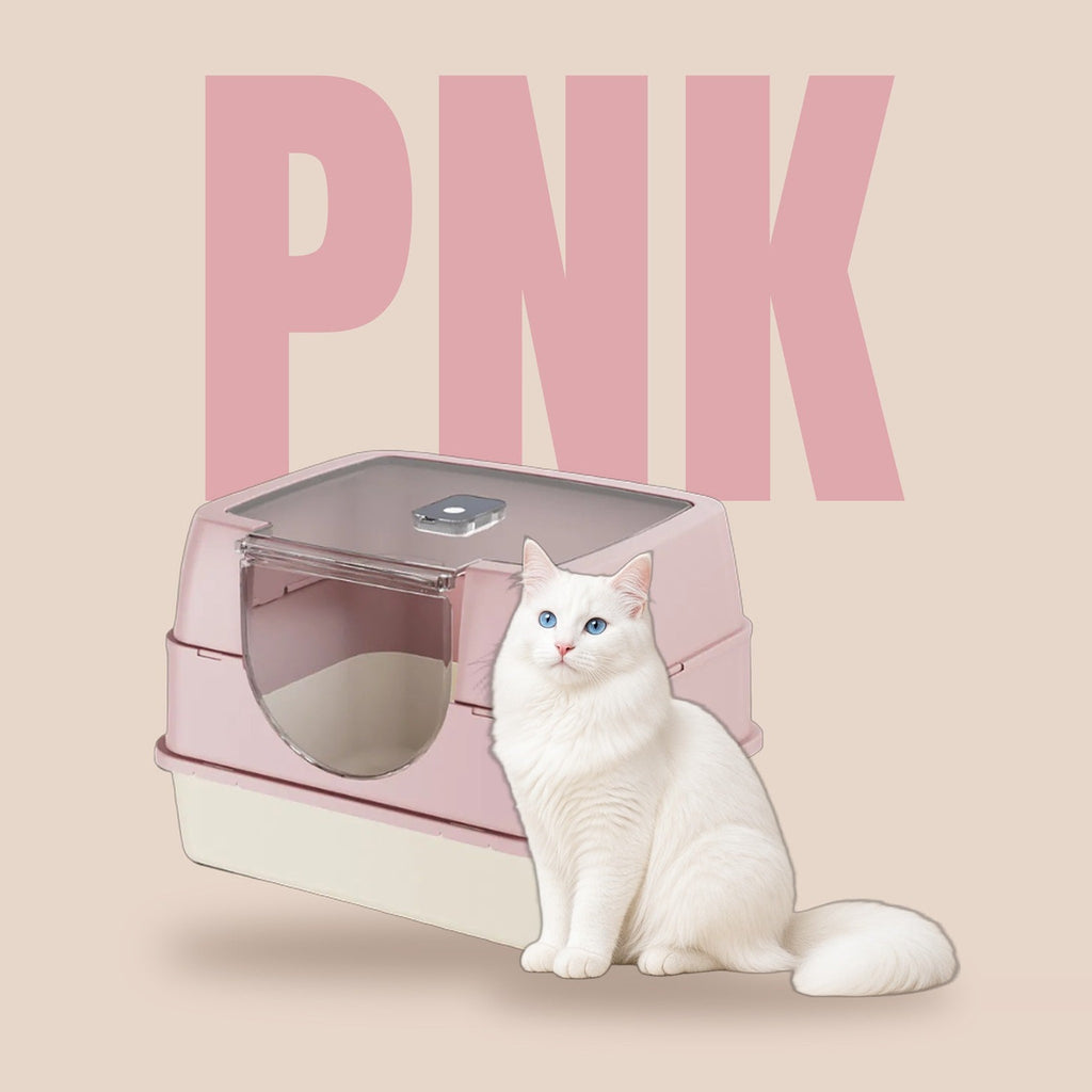 Galaxy enclosed cat litter box in blush pink with a white cat on a warm blush backdrop