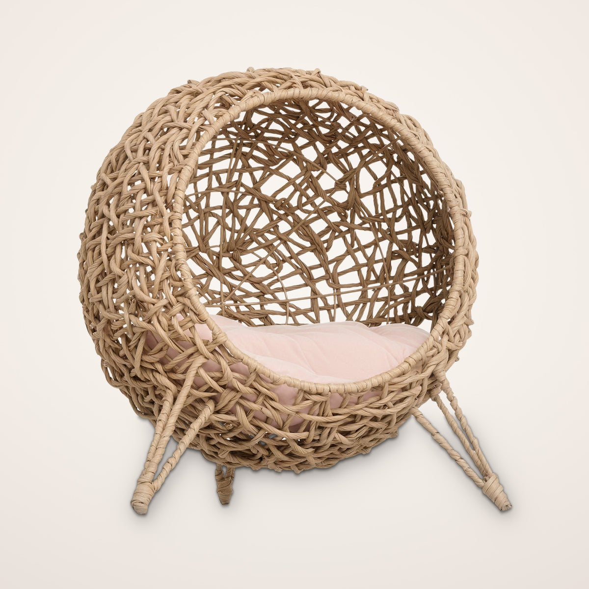 Havana hand-woven elevated cat bed, round wicker cat house on raised legs with soft blush cushion