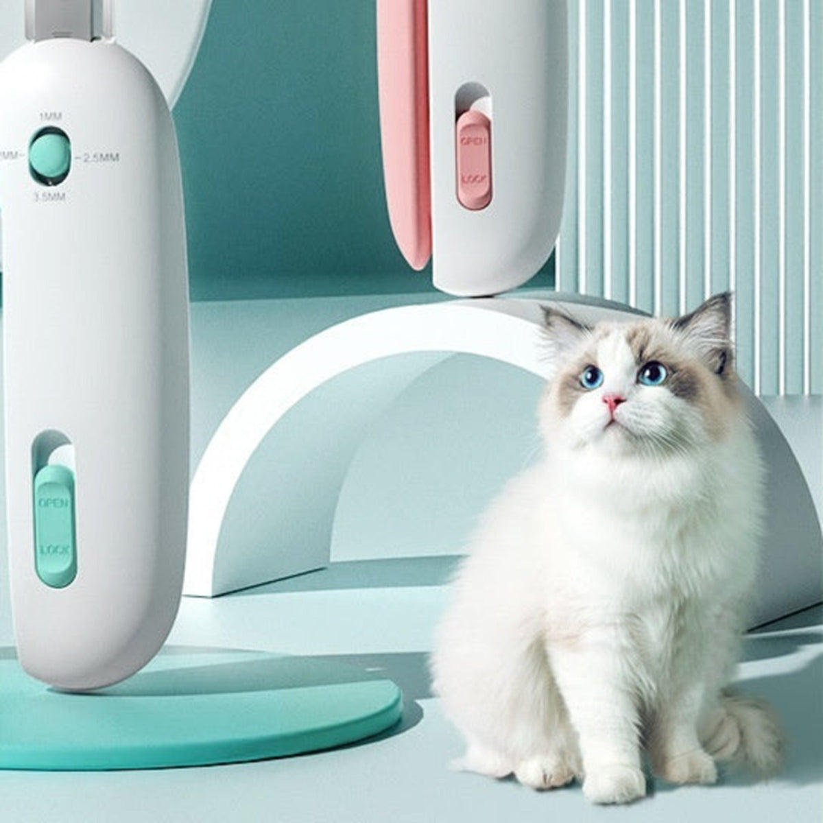 Push-style cat nail clipper beside a fluffy cat